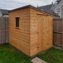 How Close Can You Put a Shed Next to a Fence?